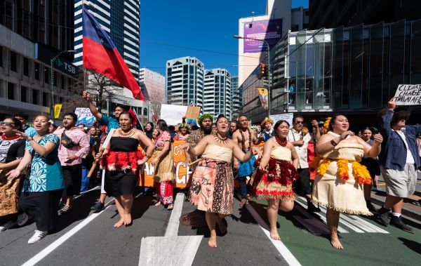 Pasifika students in protest march on a main street.