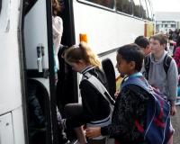 Students get on a bus.