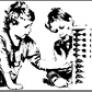 Black and white image of two boys building a block tower. 