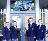 students at the entrance of Caitlins area school. 