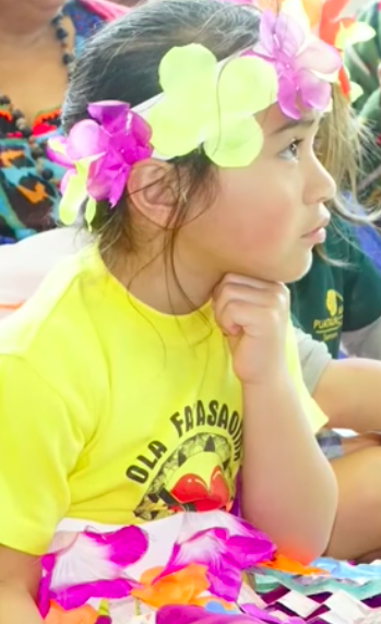 Child learning song from Tuvalu. 