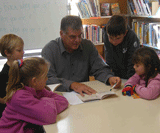 John working with students. 