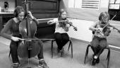 Students playing musical instruments.