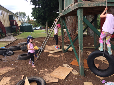 Students playing on outside fort.