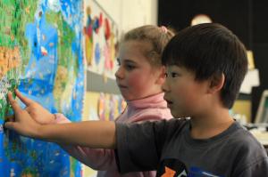Two students looking at a map.