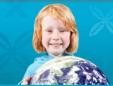 Red haired child with globe.